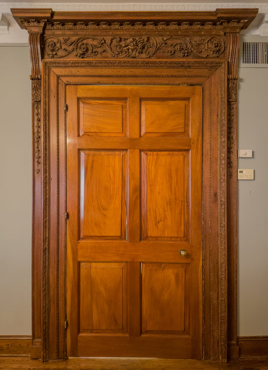 A George III door surround (the door is later). Designed by John Adam for Douglas Castle. Ca. 1757.