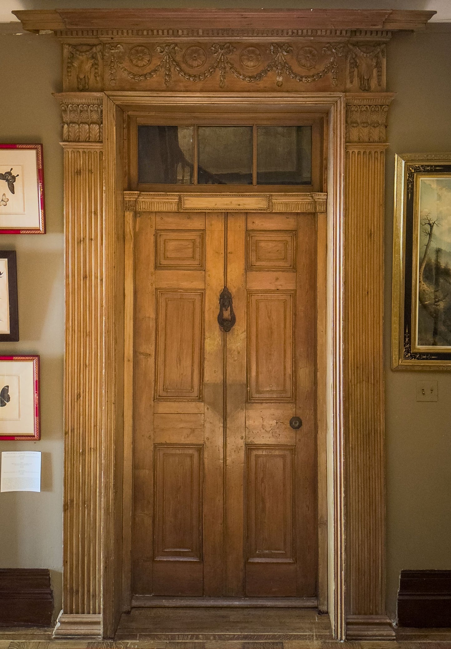 A George III pine door surround. Designed by Robert Adam for Adelphi Terrace (No. 19 Adam Street). Ca. 1768–1772.